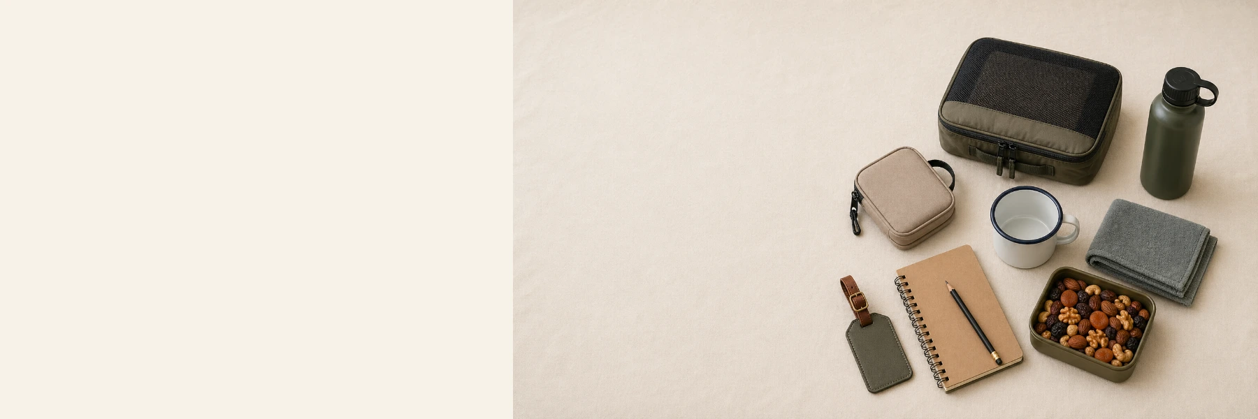 Travel accessories laid out on a neutral canvas surface